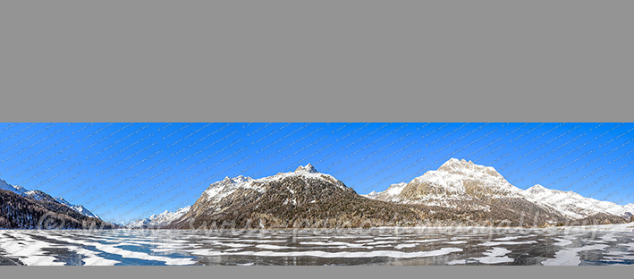 Silvaplanersee - Schwarzeis mit vom Winde verwehten Schneeansammlungen